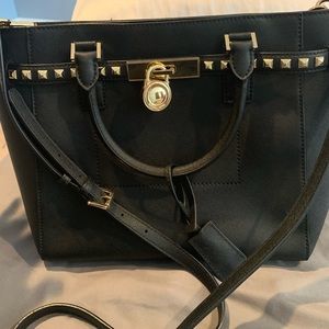 Black Michael Kors purse with cross body strap